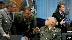 European defense officials confer at the EU Council building in Brussels, Belgium, Nov. 7, 2016. A plan to set up a joint defense fund would allow EU countries to move away from the current system, in which many pursue their own defense projects, favoring local manufacturers and duplicating efforts. 