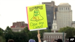 FILE - Protesters assembled by a majority Jewish group called Never Again Is Now demonstrate near Independence Hall in Philadelphia, July 4, 2019.