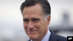 Republican presidential candidate, former Massachusetts Gov. Mitt Romney walks to his car to attend a fundraising event in Nantucket, Massachusetts, Aug. 18, 2012.