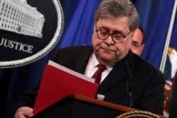 FILE - U.S. Attorney General William Barr departs after speaking at a news conference to discuss Special Counsel Robert Mueller's report on Russian interference in the 2016 U.S. presidential race, in Washington, U.S., April 18, 2019.