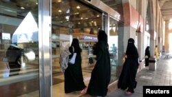 Saudi women enter the railway station in Dammam, Saudi Arabia, Aug. 5, 2019. Saudi Arabia grants “historic” new rights to women that further dismantle its heavily criticized guardianship system.