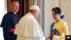 Pope Francis holds a palm branch as he leads Palm Sunday Mass in St. Peter&#39;s Basilica without public participation due to the spread of coronavirus disease (COVID-19), at the Vatican.