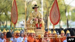 Thailand's King Maha Vajiralongkorn is carried in a golden palanquin during the coronation procession in Bangkok, May 5, 2019. 