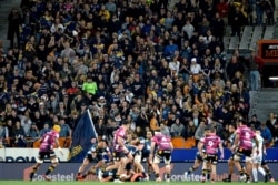 Spectators watch the Super Rugby Aotearoa rugby game between the Highlanders and Chiefs in Dunedin, New Zealand, June 13, 2020.