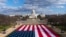 FILE - A large American flag is placed on the National Mall, with the US Capitol behind, ahead of the inauguration of President-elect Joe Biden and Vice President-elect Kamala Harris, Jan. 18, 2021.
