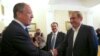 Russian Foreign Minister Sergei Lavrov, left, greets Syrian Deputy Prime Minister Qadri Jamil, right, in Moscow, Russia, July 22, 2013.