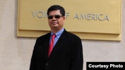 In this file photo - Nem Chhoeung, president of the Khmer Town Association, based in Georgia, posed in front of Voice of America quarters, Washington DC.