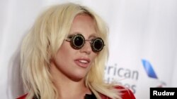 Lady Gaga poses on the red carpet before the Songwriters Hall of Fame ceremony in New York, June 18, 2015. 