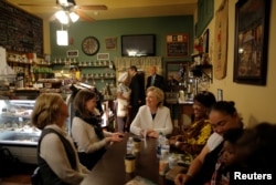U.S. Democratic presidential nominee Hillary Clinton talks to supporters at Reed's Coffee and Tea House in Philadelphia, Pennsylvania, Nov. 5, 2016.