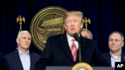 President Donald Trump, accompanied by Vice President Mike Pence, left, and House Republican Majority Whip Steve Scalise, right, speaks to members of the media after participating in a Congressional Republican Leadership Retreat at Camp David, Mary
