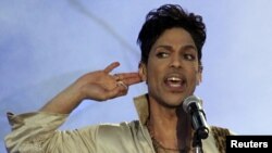 FILE - Prince performs at the 2011 Hop Farm Festival in southern England July 3, 2011. An investigation continues into the U.S. musician's death April 21, 2016. 