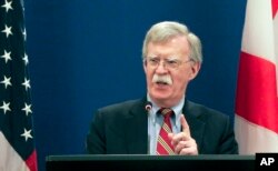 U.S. National security adviser John Bolton gestures while speaking to the media during a news briefing following his meetings with Georgian officials in Tbilisi, Georgia, Oct. 26, 2018.