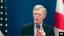 U.S. National security adviser John Bolton gestures while speaking to the media during a news briefing following his meetings with Georgian officials in Tbilisi, Georgia, Oct. 26, 2018. 