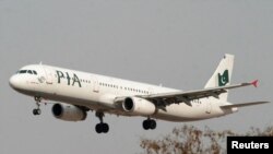 FILE - A Pakistan International Airlines (PIA) plane prepares to land at Islamabad airport in Islamabad, February 24, 2007.