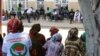 Khalifa Sall supporters sit in front of the Supreme Court, waiting for the verdict on the mayor’s request for temporary release during the election campaign, in Dakar, Senegal, July 20, 2017. (S. Christensen/VOA)