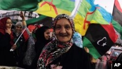 Libyans celebrate one year on since the country was declared liberated from former dictator Moammar Gadhafi, at Martyrs Square in Tripoli, Oct. 23, 2012.