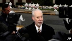 Rabbi Jeffrey Myers of the Tree of Life/Or L'Simcha Congregation stands across the street from the synagogue in Pittsburgh, Oct. 29, 2018. 