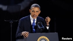 U.S. President Barack Obama, who won a second term in office by defeating Republican presidential nominee Mitt Romney, addresses supporters during his election night victory rally in Chicago, November 7, 2012.