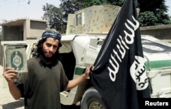 FILE - Belgian national Abdelhamid Abaaoud, shown in an undated photo published in the Islamic State's online magazine Dabiq, was believed to be the mastermind of the deadly attacks on Paris, Nov. 13, 2015. He bragged of slipping back into Europe from Syria.