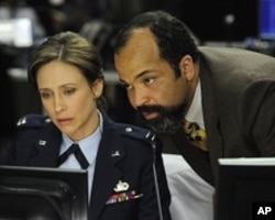 Vera Farmiga, left, in a scene from "Source Code"