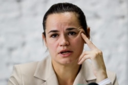 Sviatlana Tsikhanouskaya, candidate for the presidential elections, reacts during a news conference after the Belarusian presidential election in Minsk, Belarus, Aug. 10, 2020.