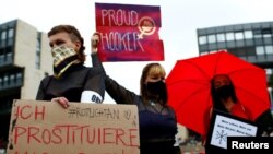 Brothel workers protest against the lockdown of their business due to the coronavirus disease (COVID-19) outbreak, in front of the federal state parliament of North Rhine-Westphalia in Dusseldorf, Germany, Aug. 27, 2020. 
