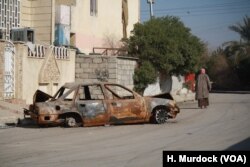 In areas of Mosul controlled by Iraqi forces, the remnants of car bombs remain strewn on the street, Jan. 11, 2017.