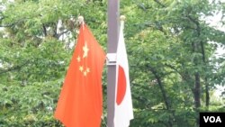 （资料照）中国总理李克强访日令东京街头8年来重现日中国旗