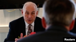 U.S. Homeland Security Secretary John Kelly talks to German Interior Minister Thomas de Maiziere during their meeting at the 53rd Munich Security Conference in Munich, Germany, Feb. 18, 2017. 