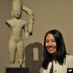 Dr.Melody Rod-ari, an assistant curator of Asian art, stands next to the god Harihara at the permanent collection of Khmer Arts at the Norton Simon Museum in Pasadena, California on July 1, 2011.