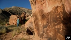 FILE - Petroglyphs are visible at the Gold Butte National Monument near Bunkerville, Nev., May 26, 2017. The monument is along the Arizona border in Southern Nevada.
