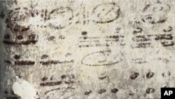 Four long numbers on the north wall of the ruined house relate to the Maya calendar and computations about the moon, sun and possibly Venus and Mars; the dates stretch some 7,000 years into the future. (Tyrone Turner © 2012 National Geographic)