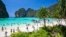 FILE - Tourists enjoy the popular Maya bay on Phi Phi island, Krabi province, March 4, 2017. Authorities ordered the temporary closing of the beach made famous by the Leonardo DiCaprio movie "The Beach" to halt environmental damage caused by too many tourists. 