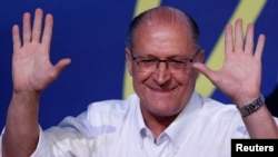 FILE - Sao Paulo's Governor Geraldo Alckmin gestures after he was elected leader of the Brazilian Social Democracy Party (PSDB) during their convention in Brasilia, Brazil, Dec. 9, 2017. 