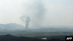 A captured image from a thermal observation device shows the explosion of an inter-Korean liaison office in North Korea's Kaesong Industrial Complex, as seen from a South Korean observation post in Paju on June 16, 2020. (Photo by STR / YONHAP / AFP)