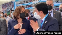 This Taiwan Central News Agency (CNA) handout picture shows Taiwan’s Vice President William Lai speaking with US Vice President Kamala Harris during Honduras' presidential inauguration in Tegucigalpa, Jan. 28, 2022.