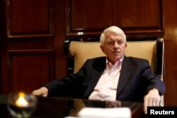 FILE - Tom Donohue, president of U.S. Chamber of Commerce, gestures during an interview with Reuters in Mexico City, Mexico, April 23, 2017.