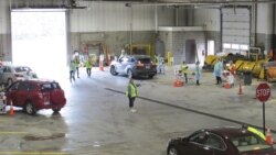 This 2020 photo provided by Carlton County shows their drive-thru flu clinic in Carlton, Minn. (Jared Hovi/Carlton County GIS via AP)
