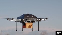 Pesawat tak berawak mini "oktokopter" yang berencana digunakan untuk mengantarkan paket-paket barang kecil dari Amazon. (Foto: Amazon)