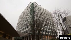 FILE - The new United States embassy building is seen during a press preview near the River Thames in London, Dec. 13, 2017