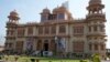 As traces of Pakistani megacity's past vanish, flamboyant pink palace endures