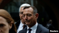 Douglas Hodge, the former chief executive of the investment firm Pimco, leaves the federal courthouse after being sentenced in connection with a nationwide college admissions cheating scheme, in Boston, Mass., Feb. 7, 2020.