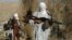 FILE - Taliban fighters carry weapons in an undisclosed location in Nangarhar province.