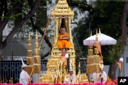 Supreme Patriarch is transported in a royal chariot during the funeral procession of Thailand's late King Bhumibol Adulyadej in Bangkok, Thailand, Oct. 26, 2017.