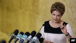 Brazil’s President Dilma Rousseff speaks with journalists after meeting with her lawyers regarding impeachment proceedings against her at Planalto presidential palace, in Brasilia, Brazil, Dec. 7, 2015.