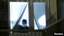 French police investigate an apartment in a residential building, during a police raid in Boussy-Saint-Antoine near Paris, France, Sept. 8, 2016.