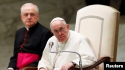 FILE - Pope Francis looks on during the weekly general audience in the Paul VI Hall, at the Vatican, Oct. 6, 2021. 