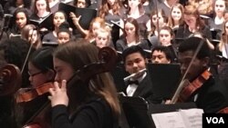 Panh Panhlauv, center, was chosen to play in this year’s High School Choir Festival for the first time as part of the D.C. Youth Orchestra Program.