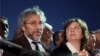 Journalist Can Dundar and his wife Dilek Dundar speak after his trial in Istanbul, late Friday, May 6, 2016. Dundar was sentenced to five years and 10 months in prison at the closed-door trial in Istanbul, while the paper's Ankara bureau chief Erdem Gul was sentenced to five years.