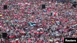 Demonstrators attend a protest in support of the National Electoral Institute (INE) and against President Andres Manuel Lopez Obrador's plan to reform the electoral authority, in Mexico City, Mexico, Feb. 26, 2023.